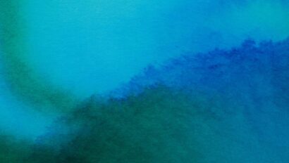 Abstract watercolor background in shades of blue and green with a soft texture gradient, ideal for IoT Solutions.