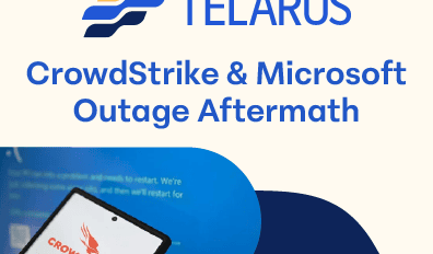 An image with the Telarus logo at the top, followed by the text "CrowdStrike & Microsoft Outage Aftermath." Below is a photo of a smartphone screen displaying the CrowdStrike logo, with a background showing a blurred blue interface. Technology advisors are working diligently to provide solutions.
