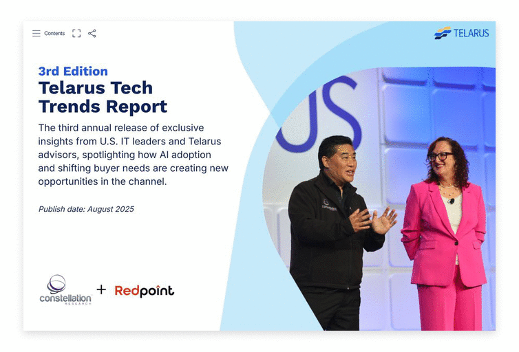 Two speakers in business attire stand on stage, smiling before a large screen displaying “Telarus Tech Trends Report,” which highlights insights like how to use AI. Logos for Constellation Research, Redpoint, and Telarus appear in the image.