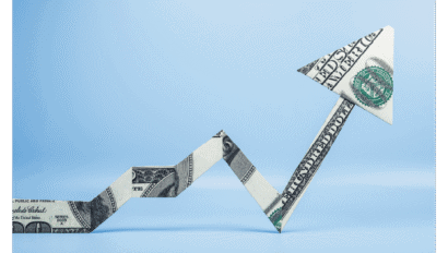 A folded U.S. dollar bill forms a zigzag upward arrow against a light blue background, symbolizing financial growth or rising profits—an image that resonates with the forward-thinking vision of Convergence Opportunity Technology Advisors.