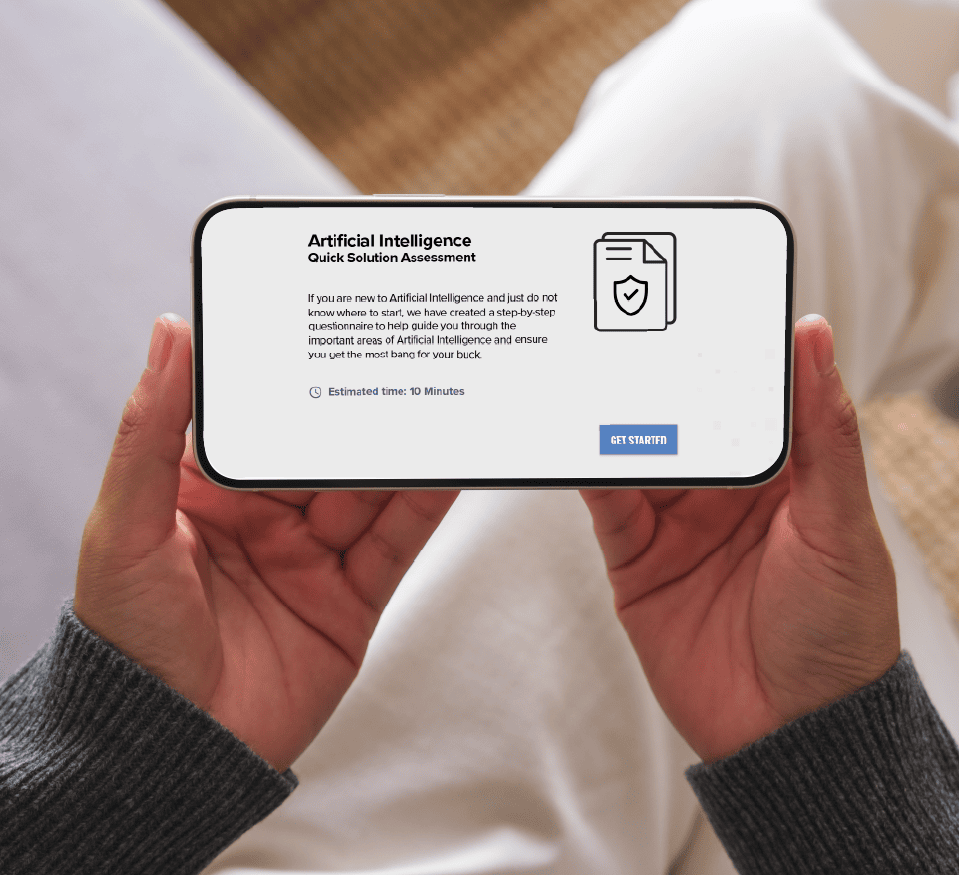 A person holds a smartphone displaying a webpage titled "Artificial Intelligence Quick Solution Assessment," featuring a document icon and a blue "Get Started" button—ideal for optimizing Sales Applications with smart, efficient solutions.